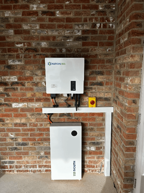 HEG Renewables Hanchu ESS inverter and home battery installation on a brick wall